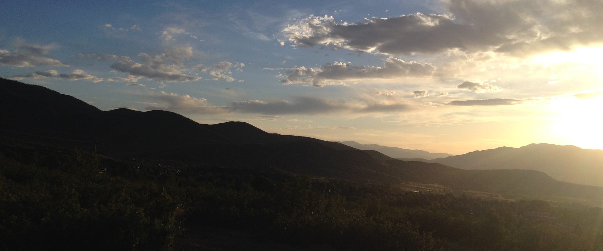 Sunset over the oak-covered foothills of Woodland Hills, Utah