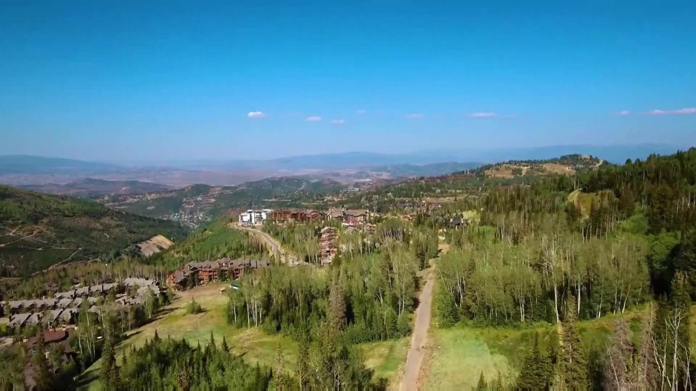 Aerial view of open Utah land and mountain foothills